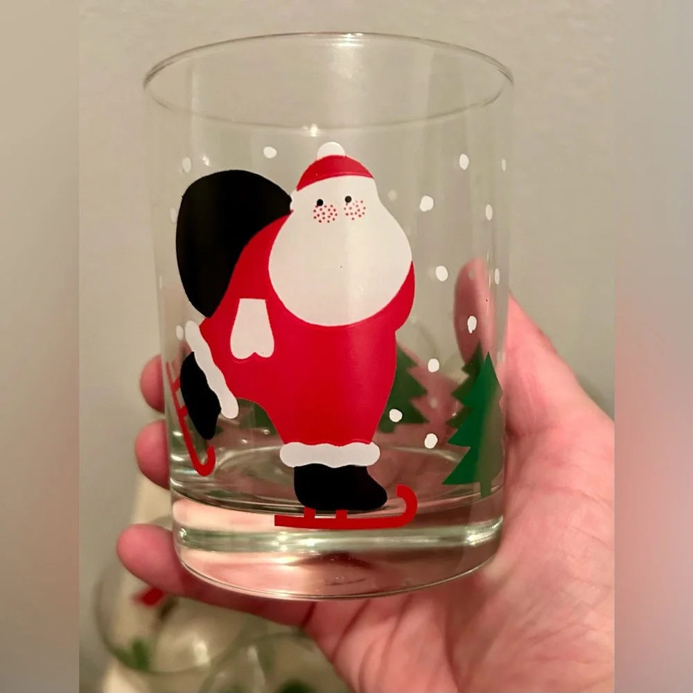 8 Crate & Barrel vintage skating Santa lowball glasses. 12oz